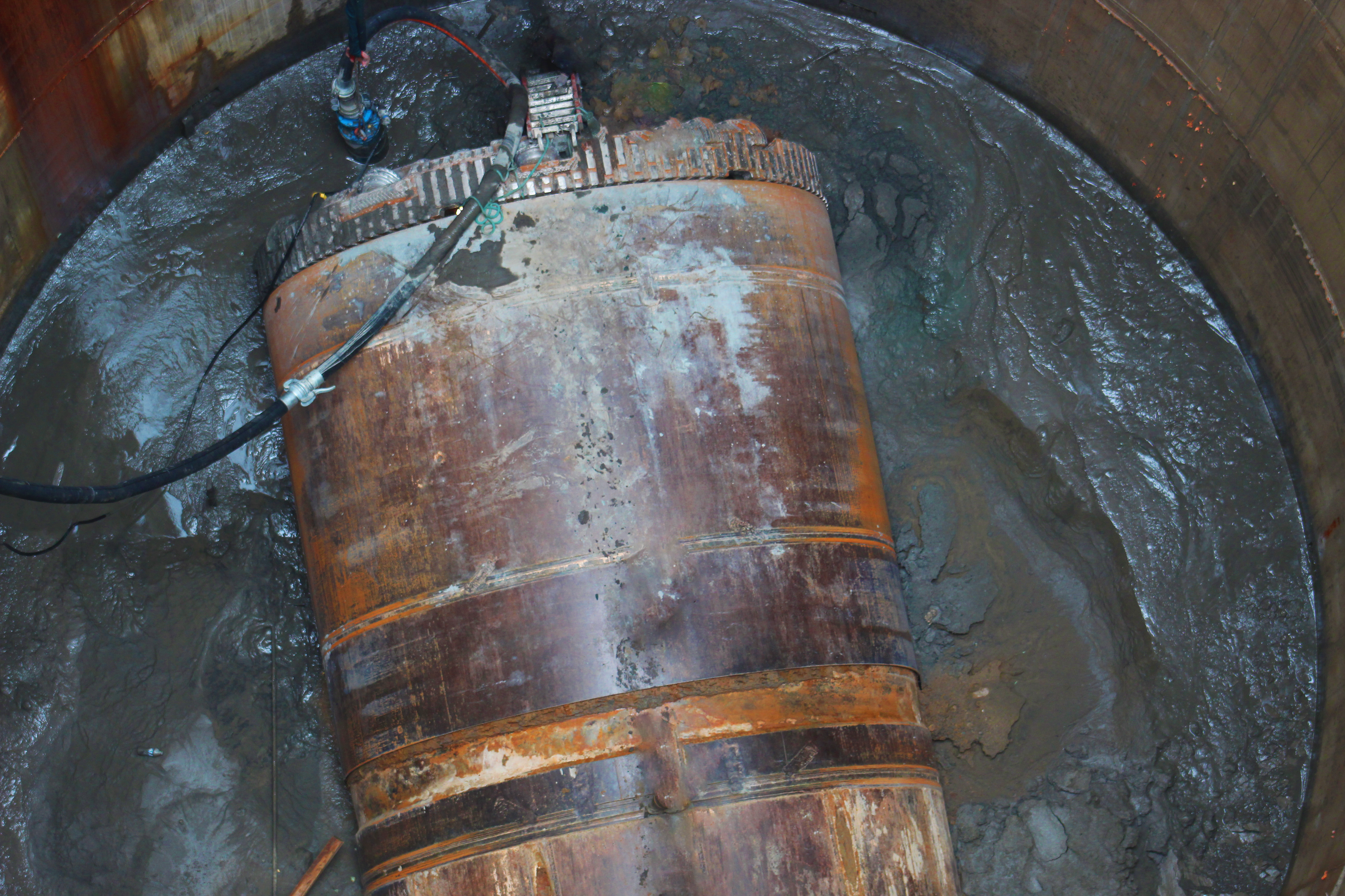 Hazel, the tunnel boring machine, sits in mud at the bottom of a shaft in Alexandria, VA.