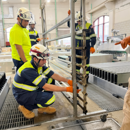 Apprentices working on ultraviolet screens on the treatment plant. 