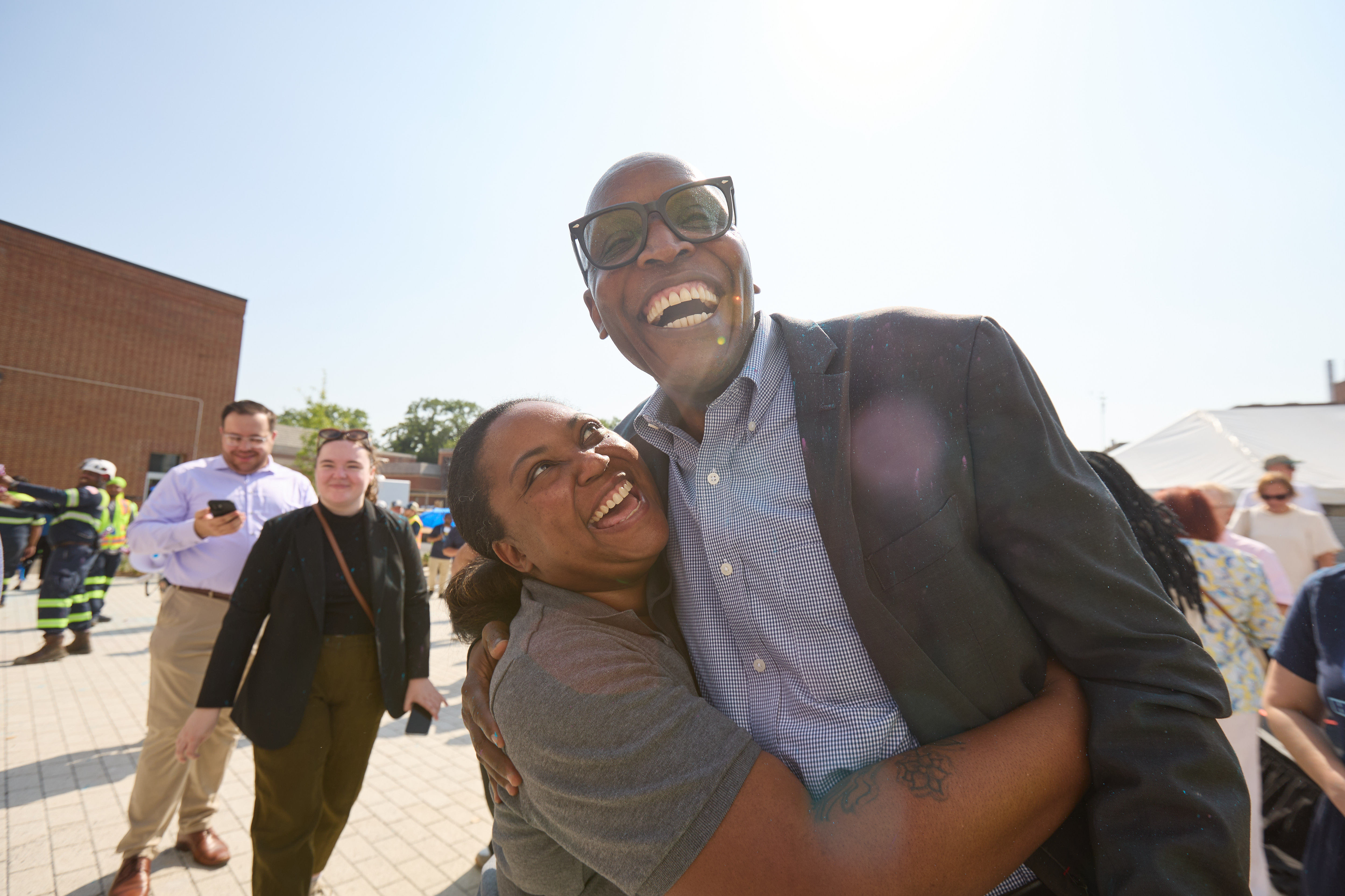 two people hug and smile in celebration