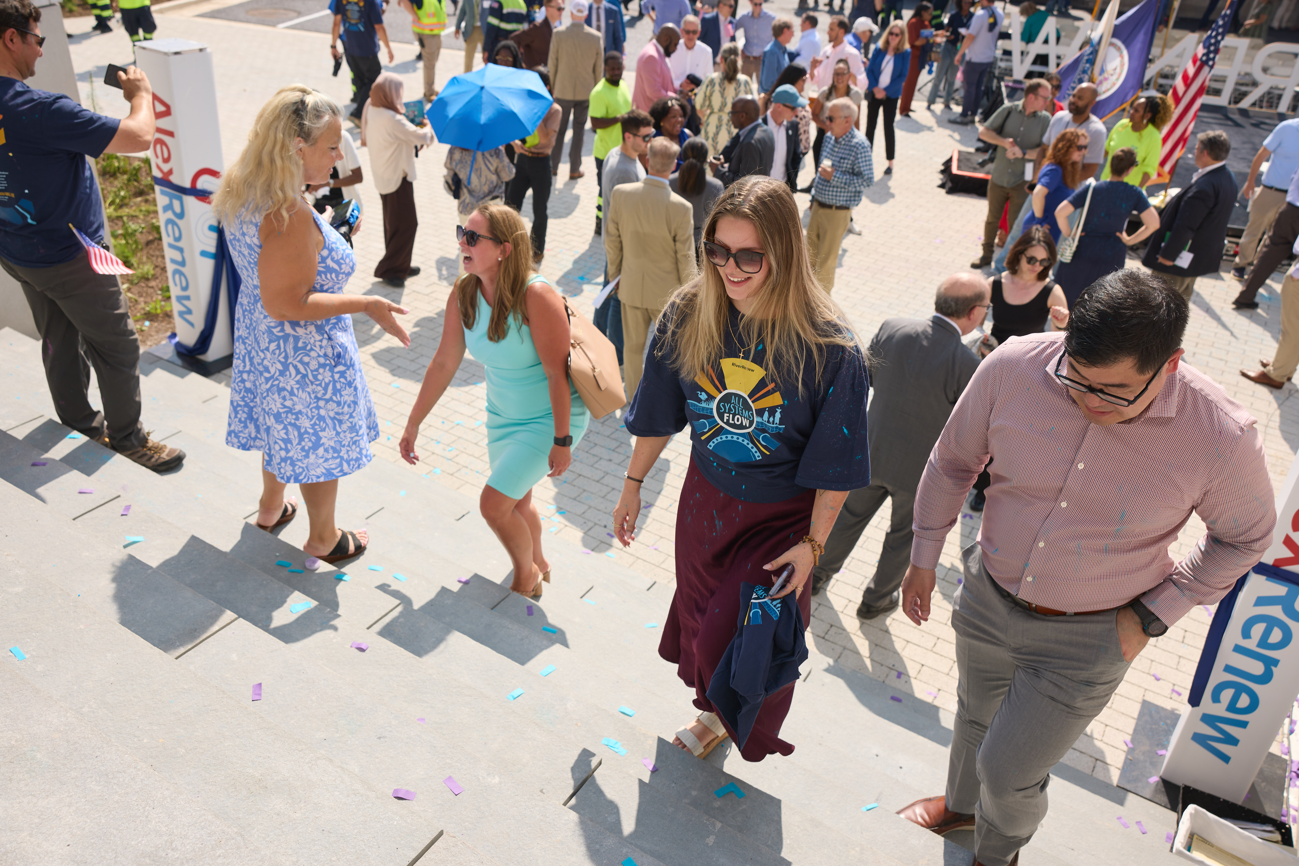 people walk up steps on their way to tour the new building